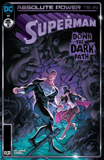 Superman #17 cover, featuring Superman (who's wearing a black version of his suit) and Zatanna in a scary, dark location surrounded by mysterious screaming faces