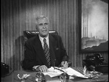 Perry White at his desk