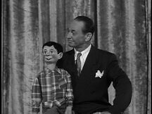 The ventriloquist with his dummy on stage