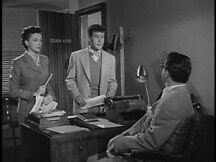 Lois and Jimmy talk to Clark in his office