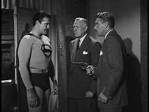 Superman talking to the two