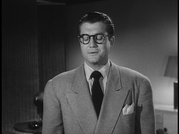 Clark Kent (portrayed by George Reeves in the Adventures of Superman) relieved