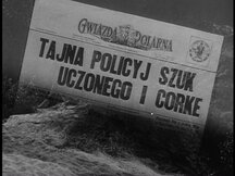 A newspaper with the Polish headline "Tajna policyj szuk uczonego i corke'