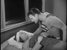 Superman talks with Maria as she wakes up